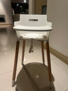 White baby high chair with oak coloured legs*